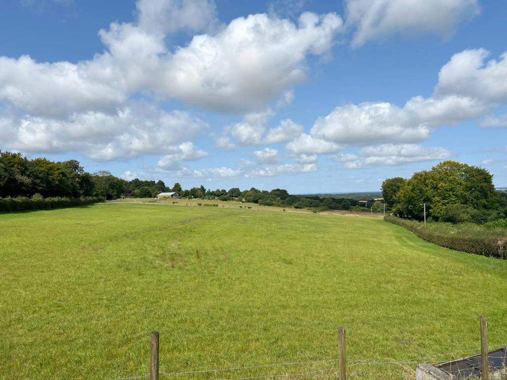 Lot: 75 - FARM BUILDINGS WITH POTENTIAL AND SIX ACRES IN A BEAUTIFUL RURAL SETTING - A View over the Land